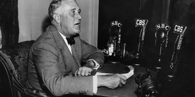 President Franklin Delano Roosevelt is shown delivering one of his "fireside chat" radio broadcasts in this 1930s photo. 