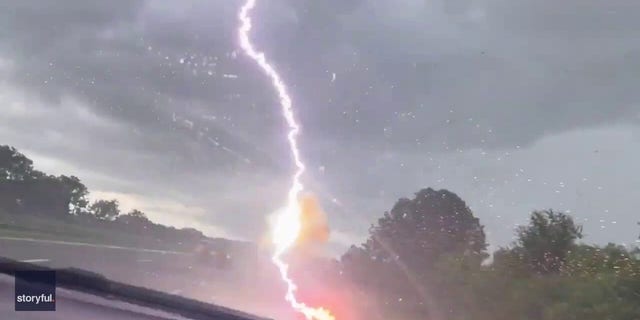 Video shows the moment lightning strikes a truck in Tampa, Florida.  