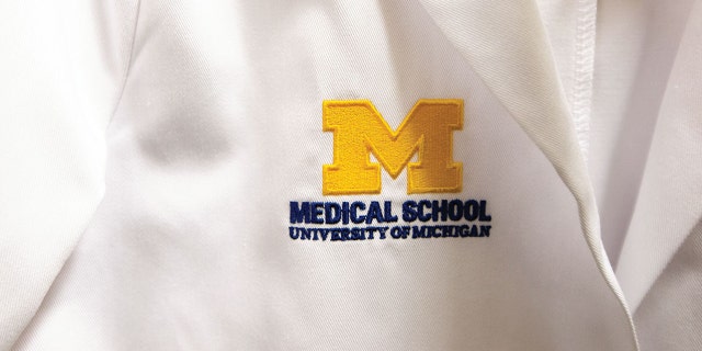 An embroidered logo of the University of Michigan Medical School.