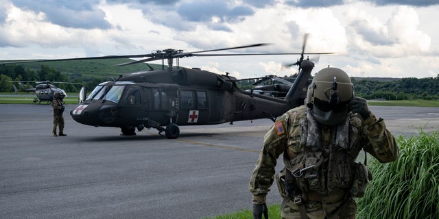 Airmen with the West Virginia National Guard prepare for search and rescue operations at Big Sandy Regional Airport.