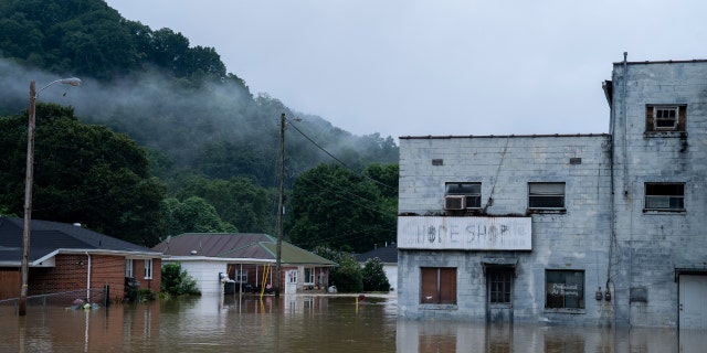 Flooding in downtown Jackson, Kentucky on July 29, 2022 in Breathitt County, Kentucky. At least 16 people have died and hundreds have had to be rescued amid flooding from heavy rains.