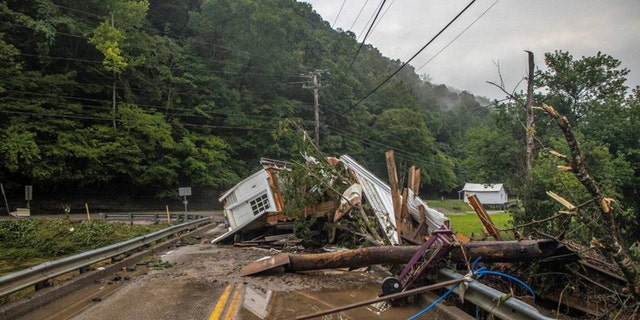A house rests on a bridge near the Whitesburg Recycling Center in Letcher County, Kentucky, on July 29, 2022. 
