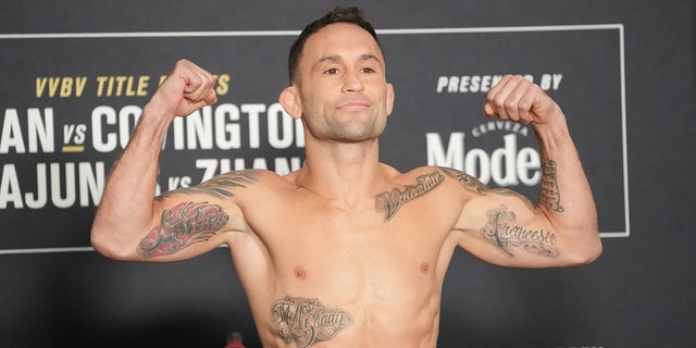 Frankie Edgar steps into a mass during the official weigh-in for UFC 268 on November 5, 2021 at Hilton Midtown in New York.