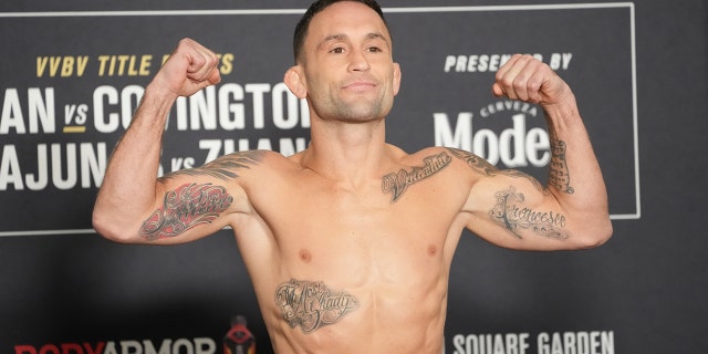 Frankie Edgar steps into a mass during the official weigh-in for UFC 268 on November 5, 2021 at Hilton Midtown in New York.