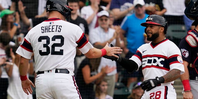 Chicago White Sox's Leury Garcia, right, celebrates with Gavin Sheets after hitting a two-run home run during the second inning of a baseball game in Chicago, Sunday, July 24, 2022.