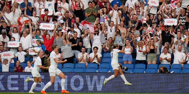 England's Georgia Stanway, right, celebrates after scoring the opening goal from the penalty spot during the Women Euro 2022 group A soccer match between England and Norway at Brighton & Hove Community Stadium in Brighton, England, Monday, July 11, 2022. 