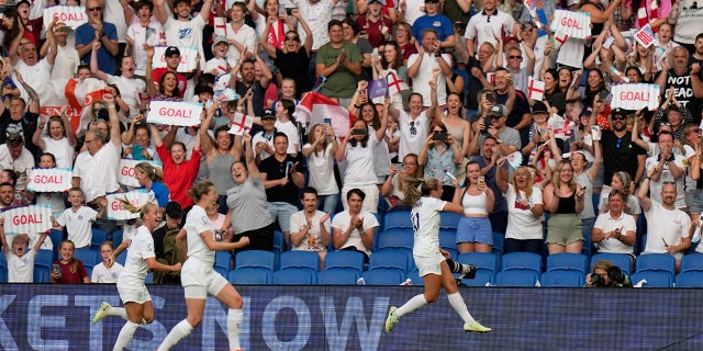 England's Georgia Stanway, right, celebrates after scoring the opening goal from the penalty spot during the Women Euro 2022 group A soccer match between England and Norway at Brighton & Hove Community Stadium in Brighton, England, Monday, July 11, 2022.