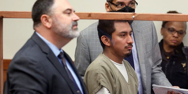 Gerson Fuentes, center, the man accused of raping a 10-year-old girl who then traveled to Indiana to have an abortion, appears between his lawyer Bryan Bowen, left, and his interpreter in Franklin County common pleas court for his bond hearing in Columbus, Ohio, on Thursday.