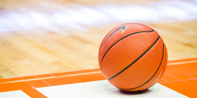 Detail view of Nike basketball on the court.