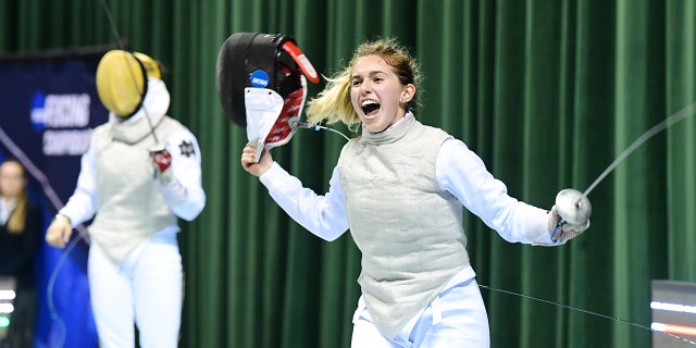 Amita Berhier, of Notre Dame, watches as Sylvie Binder of Columbia celebrates after winning the Foil semifinals during the Division I Women's Fencing Championship held at The Wolstein Center on the Cleveland State University campus on March 24, 2019 in Cleveland, Ohio.