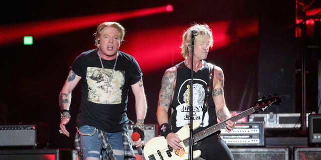 Although they were forced to cancel this show, they assured their fans they are working towards rescheduling, and encouraged them not to get rid of their tickets just yet. Axl Rose and Duff McKagan of Guns N' Roses are pictured here in 2019. 