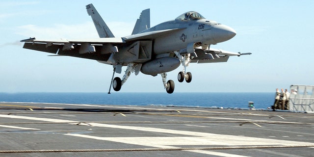 FILE- An F / A18 "Super hornet" piloted by Lt. Corey L. Pritchard makes the first aircraft carrier landing of the new aircraft on July 24, 2002 aboard USS Abraham Lincoln.
