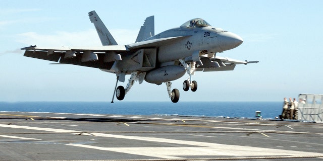 FILE- An F/A18 "Super Hornet" piloted by Lt. Corey L. Pritchard makes the first carrier landing of the new plane July 24, 2002 onboard the USS Abraham Lincoln.