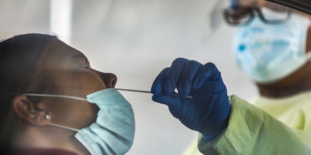 Trace Robinson receives a coronavirus test at an Affinia testing site in St. Louis on Thursday, April 23, 2020. 