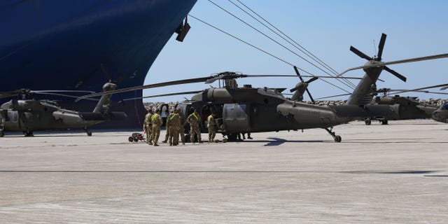 Troops of the 101st Airborne Combat Aviation in uniform on duty working on the helicopters on July 23, 2020.