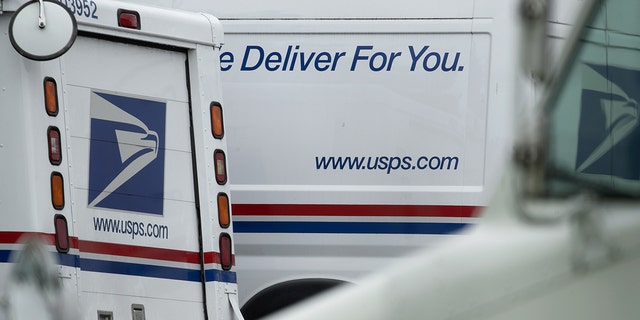 USPS trucks sit at a U.S. Postal Service (USPS) facility in Elkridge, Maryland, U.S., on Sunday, Aug. 16, 2020. 