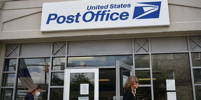 Customers outside a US Post Office in Bethesda, Maryland on August 21, 2020.