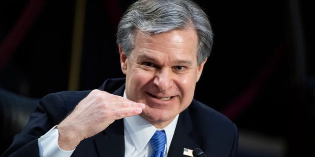FBI Director Christopher Wray testifies during a Senate Judiciary Committee hearing March 2, 2021.
