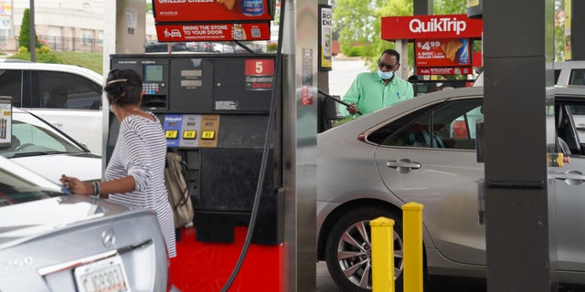 Consumers pump gas at a QuikTrip gas station on May 11, 2021, in Smyrna, Georgia. - Fears the shutdown of a major fuel pipeline would cause a gasoline shortage led to some panic buying and prompted US regulators on May 11, 2021 to temporarily suspend clean fuel requirements in three eastern states and the nation's capital. A ransomware attack Friday on Colonial Pipeline forced the company to shut down its entire network, though industry experts say any shortages will be temporary. (Photo by Elijah Nouvelage / AFP) (Photo by ELIJAH NOUVELAGE/AFP via Getty Images)