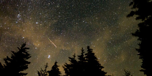 In this 30-second exposure, a meteor streaks across the sky during the annual Perseid meteor shower on Aug. 11, 2021, in Spruce Knob, West Virginia.