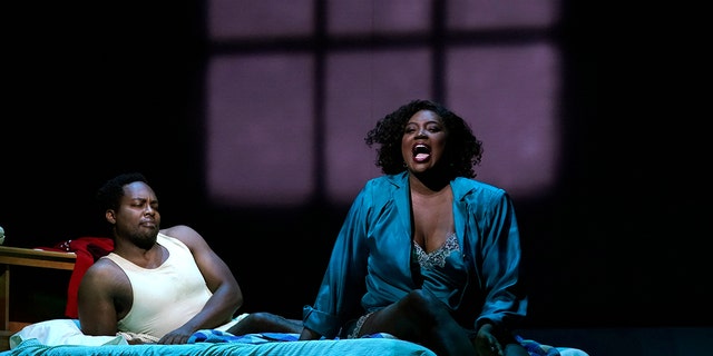 Actors Angel Blue and Will Liverman  perform a scene during a rehearsal for Terence Blanchard's "Fire Shut Up in My Bones," at the Metropolitan Opera on September 24, 2021 in New York. 