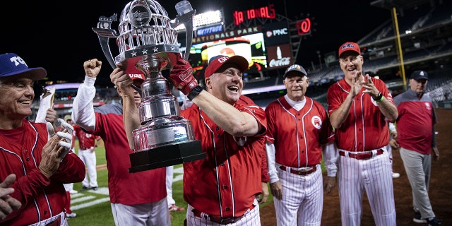 Steve Scalise hoists trophy on baseball field