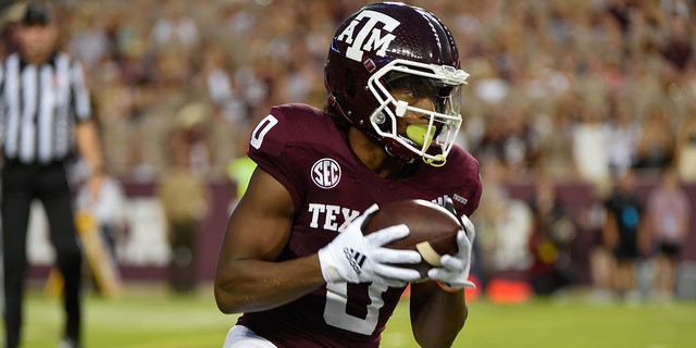 Texas A&M Aggies wide receiver Ainias Smith (0) puts in a punt early in the first quarter, then returns it over 90 yards for a touchdown during the game between the South Carolina Gamecocks and Texas A&M Aggies at Kyle Field on October 23, 2021 at College Station, Texas. 