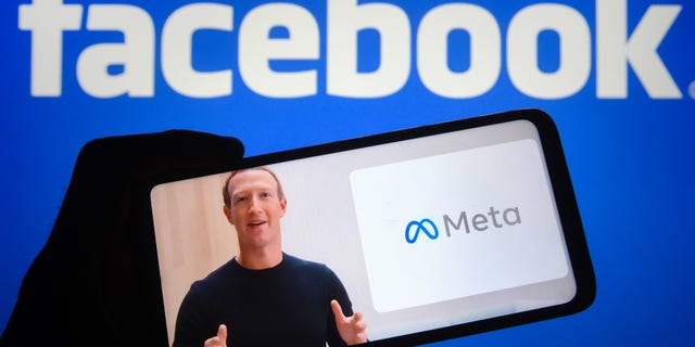 In this photo illustration, Facebook CEO Mark Zuckerberg is seen on a video displayed on a smartphone screen as he announces the new name for Facebook: Meta.