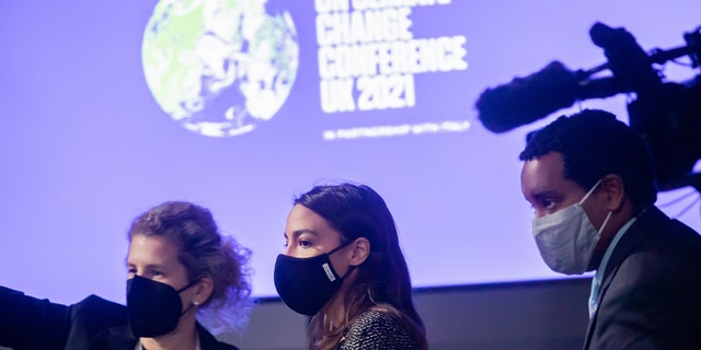 Alexandria Ocasio-Cortez (M), Democratic U.S. Congresswoman and Representative for New York State, arrives for a press conference with House Speaker Pelosi at the COP26 UN Climate Change Conference in Glasgow. (Photo by Christoph Soeder/picture alliance via Getty Images)