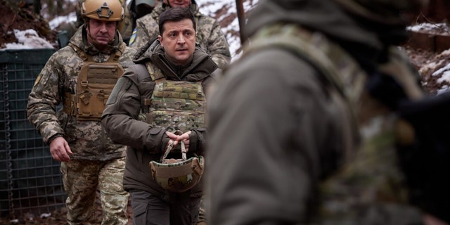 DONBASS, UKRAINE - DECEMBER 06: (----EDITORIAL USE ONLY â MANDATORY CREDIT - "UKRAINIAN PRESIDENCY / HANDOUT" - NO MARKETING NO ADVERTISING CAMPAIGNS - DISTRIBUTED AS A SERVICE TO CLIENTS----) Ukrainian President Volodymyr Zelensky visits the front-line positions of Ukrainian military in Donbass, Ukraine on December 06, 2021. (Photo by Ukrainian Presidency / Handout/Anadolu Agency via Getty Images)