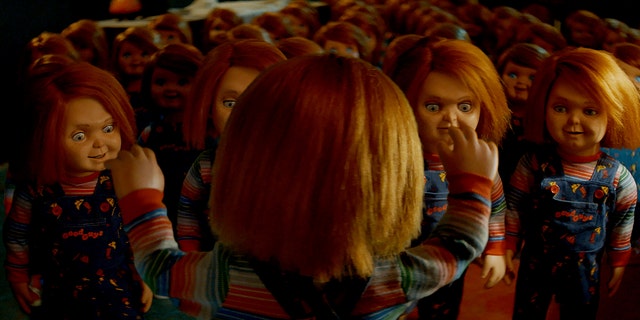 Chucky from the Syfy series "Chucky" speaks to other Chucky dolls. 