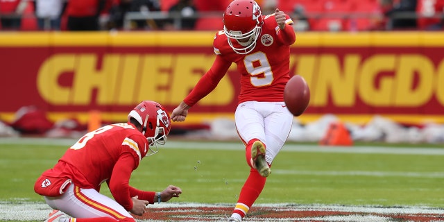 Kansas City Chiefs kicker Elliot Fry (9) kicks from the hold of punter Johnny Townsend (8) before a game against the Pittsburgh Steelers Dec 26, 2021, at GEHA Field at Arrowhead Stadium in Kansas City, Mo.