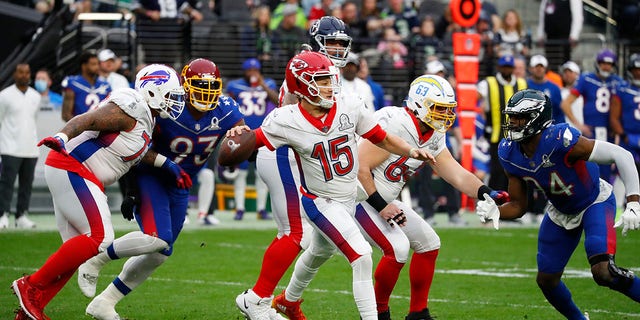 Kansas City Chiefs quarterback Patrick Mahomes, 15, attempts to pass the ball during the Pro Bowl on February 6, 2022 at Allegiant Stadium in Las Vegas. 