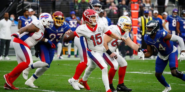 Kansas City Chiefs quarterback Patrick Mahomes, 15, attempts to pass the ball during the Pro Bowl on February 6, 2022 at Allegiant Stadium in Las Vegas. 