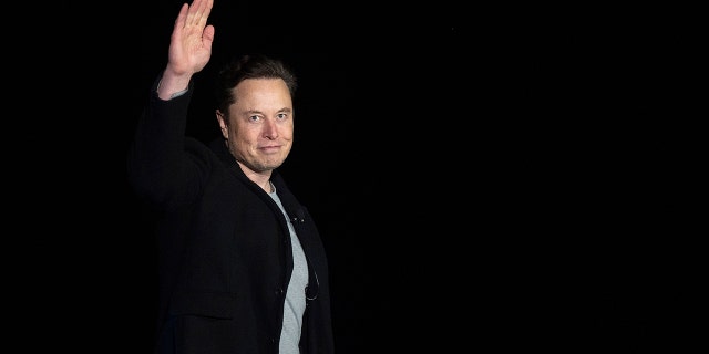 Elon Musk makes a speaking gesture at a press conference on February 10, 2022 at SpaceX's Starbase facility near Bokatika Village in southern Texas.  (Photo courtesy of JIM WATSON / AFP) (Photo courtesy of JIM WATSON / AFP, via Getty Images)