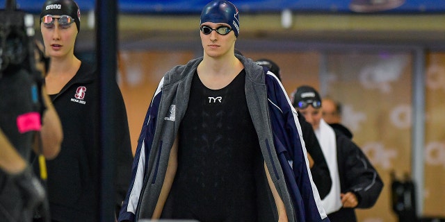 University of Pennsylvania swimmer Lia Thomas, center, enters the 200 Freestyle final during the NCAA Swimming and Diving Championships on March 18, 2022 at the McAuley Aquatic Center in Atlanta.