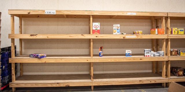 Empty shelves ahead of a food delivery at the West Alabama Food Bank in Northport, Alabama, U.S. Photographer: Andi Rice/Bloomberg via Getty Images