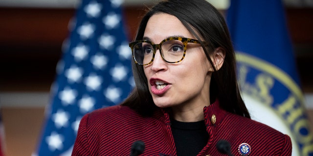 Rep. Alexandria Ocasio-Cortez, D-N.Y., conducts a news conference in the Capitol Visitor Center on banning members of Congress from trading stocks on Thursday, April 7, 2022.