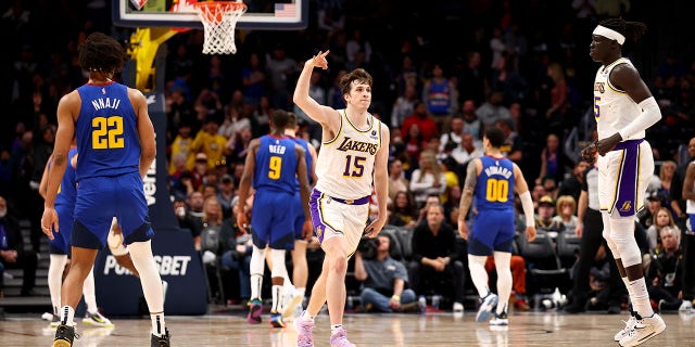 Austin Reeves (15) of the Los Angeles Lakers reacts to a 3-pointer against the Denver Nuggets at Ball Arena on April 10, 2022 in Denver, Colorado.