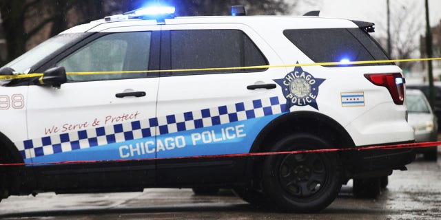 Bullet casings litter the street as police investigate the scene of a shooting on West Congress Parkway in Chicago, Tuesday, Feb. 22, 2022.