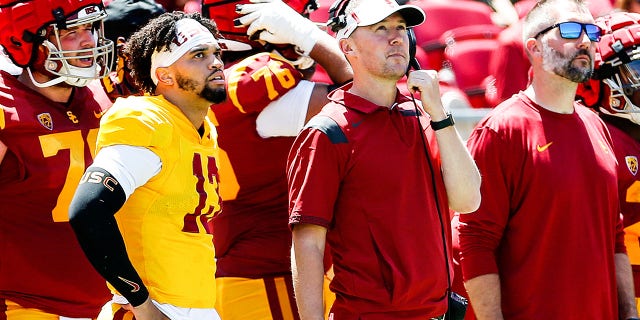 Caleb Williams, #13 and USC quarterback, and head coach Lincoln Riley, during the USC Football Spring Game at the Los Angeles Memorial Coliseum on Saturday, April 23, 2022 in Los Angeles, CA.