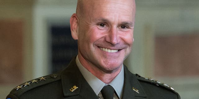 U.S. Army General Christopher G. Cavoli smiles as he is awarded the Bavarian Order of Merit by the Bavarian Prime Minister.