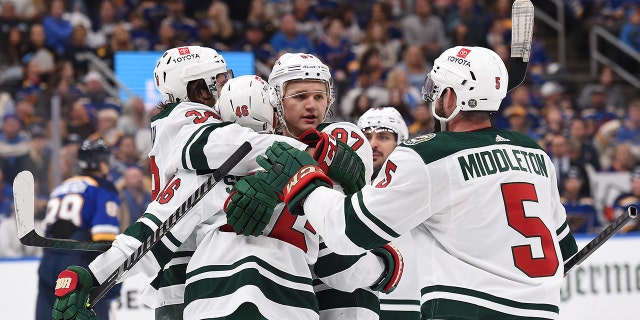 Kirill Kaprizov (97) of the Minnesota Wild is congratulated after scoring a goal against the St. Louis Blues in the first period of Game 4 of the first round of the 2022 Stanley Cup playoffs at Enterprise Center May 8, 2022, in St Louis, Mo.