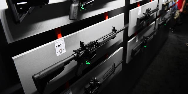 A Springfield Armory SAINT M-LOCK AR-15 semi-automatic rifle is displayed on a wall of guns during the National Rifle Association (NRA) Annual Meeting at the George R. Brown Convention Center, in Houston, Texas on May 28, 2022. 