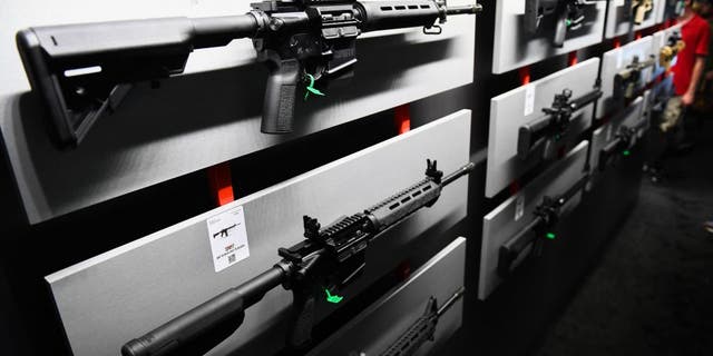 A Springfield Armory SAINT M-LOCK AR-15 semi-automatic rifle is displayed on a wall of guns during the National Rifle Association (NRA) Annual Meeting at the George R. Brown Convention Center, in Houston, Texas on May 28, 2022. 