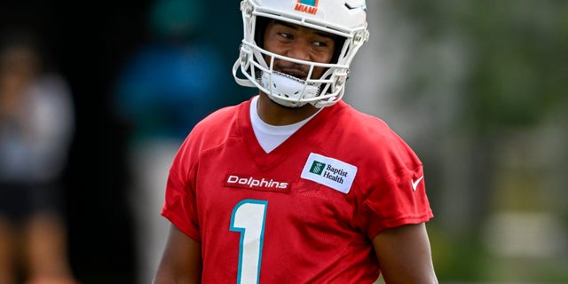 Miami Dolphins quarterback Tua Tagovailoa smiles during the first mandatory minicamp at the Baptist Health Training Complex in Miami Gardens, Fla., on June 1, 2022.