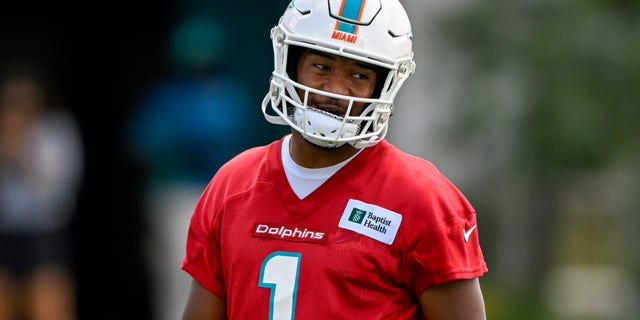 Miami Dolphins quarterback Tua Tagovailoa smiles during the first mandatory minicamp at the Baptist Health Training Complex in Miami Gardens, Fla., on June 1, 2022.