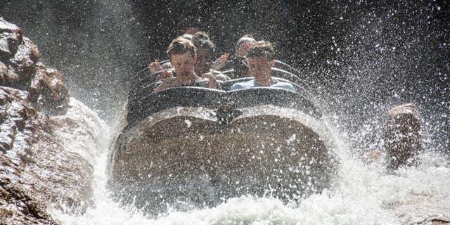 Guest react to being hit with cool water on Splash Mountain at the Magic Kingdom Park at Walt Disney World in Orange County, Florida on June 1, 2022. 