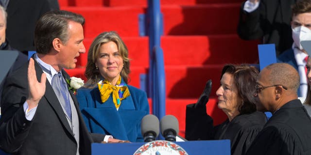 Glenn Youngkin is sworn in as Virginia's 74th governor with wife Suzanne at his side on the front steps of the Virginia State Capitol Jan. 15, 2022, in Richmond, Va.