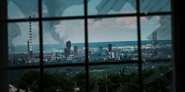 LYSYCHANSK, UKRAINE -- JUNE 13, 2022: A view of Severodonetsk, as seen from Lysychansk, Ukraine, Monday June 13, 2022. (Marcus Yam / Los Angeles Times via Getty Images)